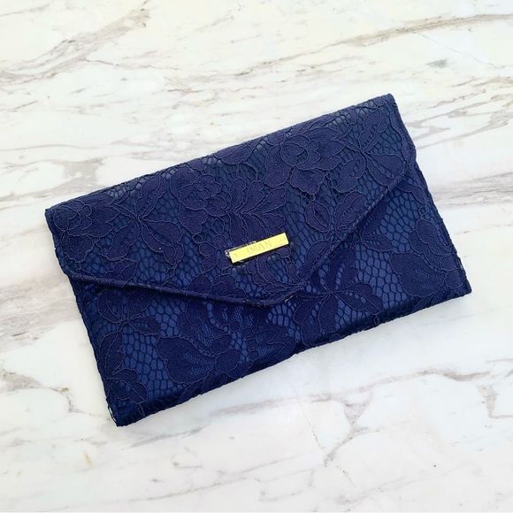 IMAN Handbags - NWT IMAN Navy Blue Lace Clutch